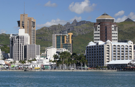 Cityscape of buildings in Port louis Mauritius over mountains backgroundの写真素材