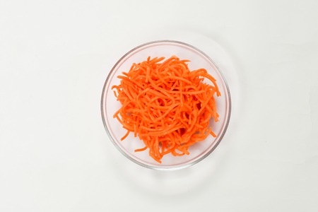Orange carrots in a glass bowlの写真素材