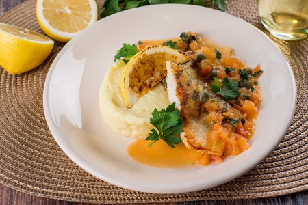 Baked fish with mashed potatoes and steamed spinachの写真素材