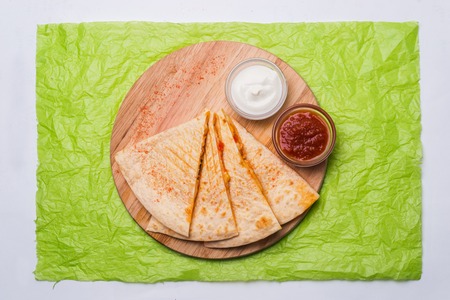 Quesadilla on a wooden table close-up shot topの写真素材
