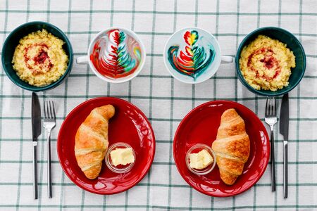 Breakfast with cereals and croissants photographed close-up on topの写真素材