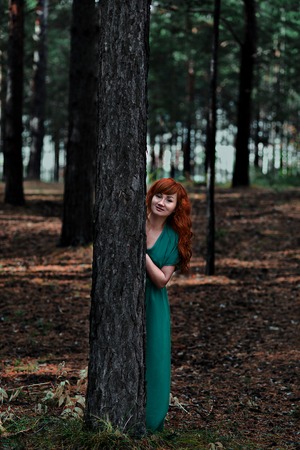 Red-haired girl in the woods. Fantasy conceptの写真素材