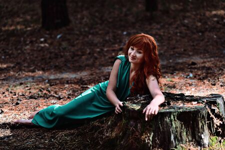 Red-haired girl in the woods. Fantasy conceptの写真素材
