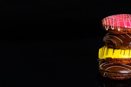 Donuts on a dark background filmed in studio
