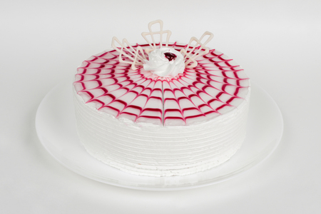 Celebratory cake on white shot close-up on whiteの写真素材