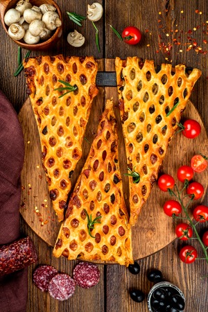 Three slices of pie filled with filling toppedの写真素材