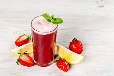 Strawberry and lemon juice decorated with mint. Close-up shotの写真素材