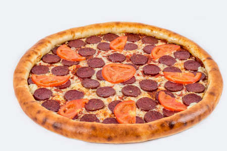 Pepperoni pizza shot on a white plate under the tenderloin close-upの写真素材