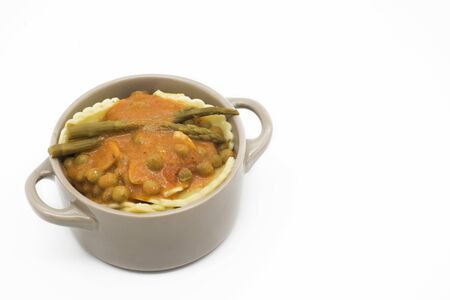 casserole, Italian stuffed pasta with asparagus and peas in tomato Isolated backgroundの写真素材