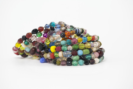 spiral bracelet of colored stones, transparent, on dark backgroundの写真素材