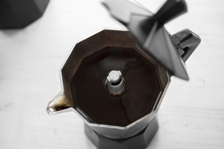 italian coffeemaker with black coffee ready, open lidの写真素材