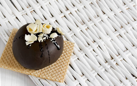 Round chocolate dessert,  with white chocolate chips の写真素材