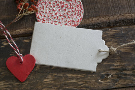 White labels, lace and rustic wooden background thread in geometric shapes の写真素材