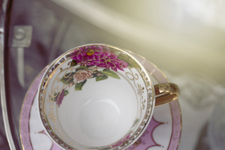 Antique porcelain mug, decorated with pink bouquet の写真素材