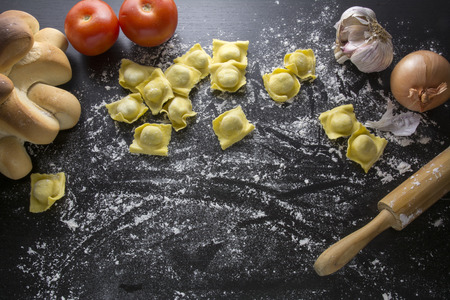 Raw ravioli on black backgroundの写真素材