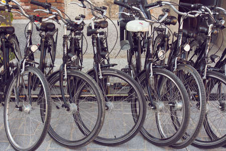 Station of urban black bicycles for rent, in the city of Madrid, Spainのeditorial素材