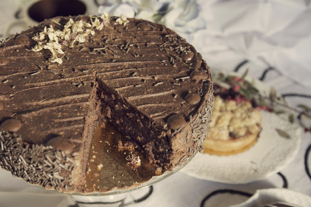 Chocolate cakes and Coffee table with teacups