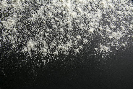 white flour dusted, black backgroundの写真素材