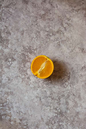 Orange halved, on light grungeの写真素材