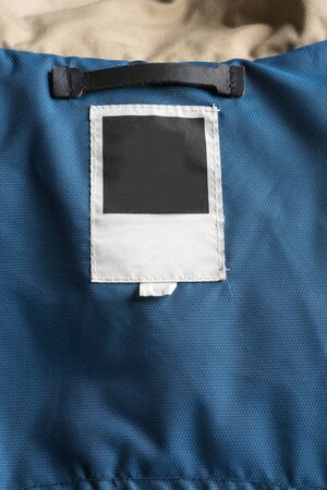 Price Tag, in the pocket of a blue winter jacket