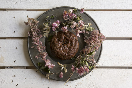 Delicious brownie decorated with pink flowers on white backgroundの写真素材