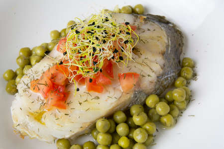 Hake fillet with tomato and sprouts,の写真素材
