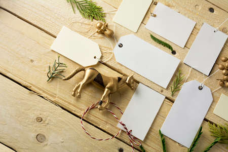 Set of empty paper price tags, wooden backgroundの写真素材