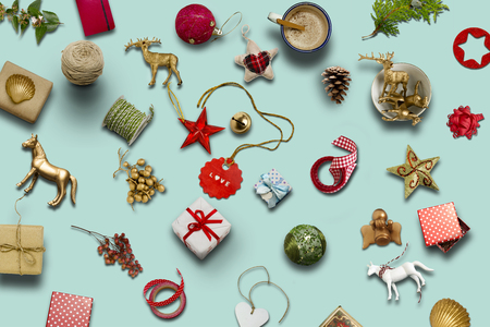 Christmas collection, gifts and decorative ornaments, on blue background. photographic montage