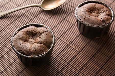 coulant two cakes on brown bamboo placemat