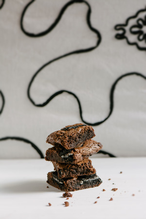 Chocolate brownies, with black biscuit stuffed with creamの写真素材