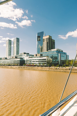 BUENOS AIRES, ARGENTINA - MAY 09, 2017: Cables system of Puente de la Mujer, (Bridge Of The Women) Modern buildings of the district of Puerto Madero. Buenos Aires, Argentinaのeditorial素材