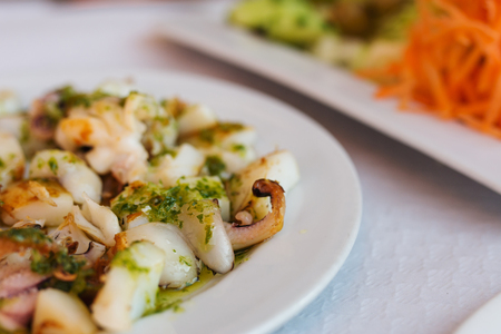 octopus with garlic, olive oil and parsley, typical Mediterranean Spanish food. Detail
の写真素材