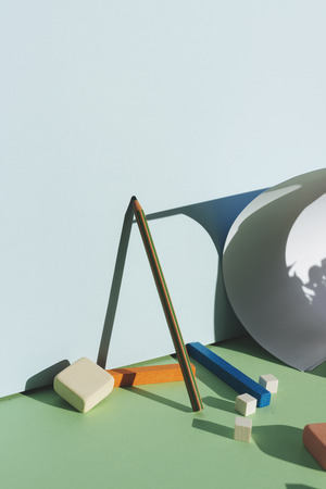 Pencil leaning against the blue wall, reflecting the shadow with direct light. Back to school conceptの写真素材