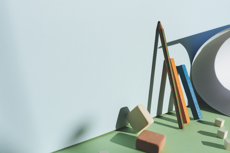 Pencil leaning against the blue wall, reflecting the shadow with direct light. Back to school conceptの写真素材
