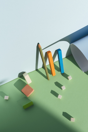 Pencil leaning against the blue wall, reflecting the shadow with direct light. Back to school conceptの写真素材