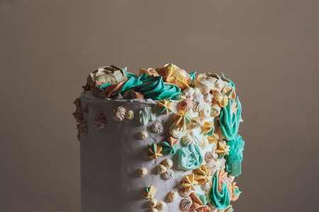 Cake decorated with Swiss meringue in the shape of flowers, pastel colors.の写真素材