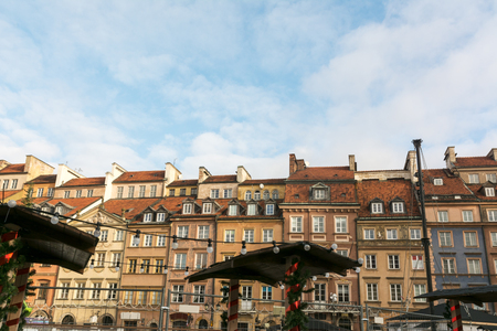 Christmas market in Warsaw Old Town Market Square, detail of the old colorful facadesの写真素材