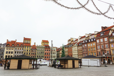 Christmas market in Warsaw Old Town Market Square, detail of the old colorful facadesの写真素材