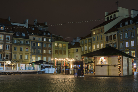 Christmas market in Warsaw Old Town Market Square, decorated with night illuminationの写真素材
