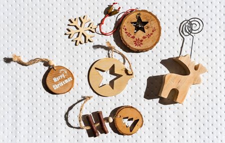 Modern wooden ornaments with a Christmas message for decoration. Christmas backgroundの写真素材