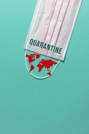 Surgical mask with a map of the world, Concept of global spread of Coronavirus Novel Covid-19. Coronavirus outbreak virus quarantine backgroundの写真素材