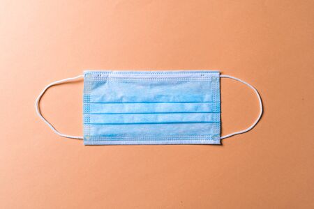 Disposable Surgical mask with rubber ear straps. Typical 3-ply surgical mask to cover the mouth and nose. Procedure mask from bacteria. Healthcare and medical concept. Nobodyの写真素材