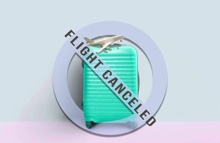 Turquoise suitcase standing with "no entry sign" and message . Stop travel to risk places COVID-19. prevention of contagion. Coronavirus crisis in travel and tourism industry conceptの写真素材