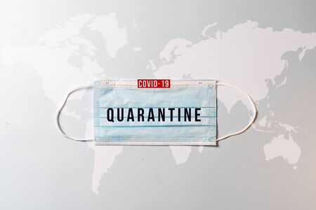Surgical mask with a map of the world, Concept of global spread of Coronavirus Novel Covid-19. Coronavirus outbreak virus quarantine backgroundの写真素材