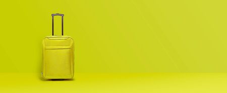 Lime green suitcase standing next to the color wall. Concept travel