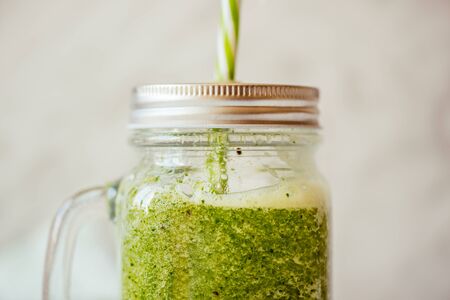 Healthy green smoothie in glass jar. Superfoodの写真素材