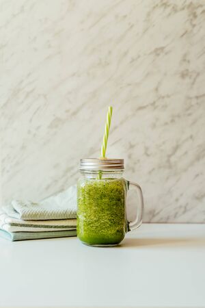 Healthy green smoothie in glass jar. Superfoodの写真素材