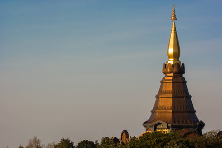 Sun rise at Golden pagoda with blue skyの写真素材