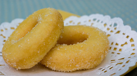Donut on plate with green backgroundの写真素材