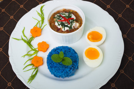 steamed fish with curry paste egg and riceberryの写真素材